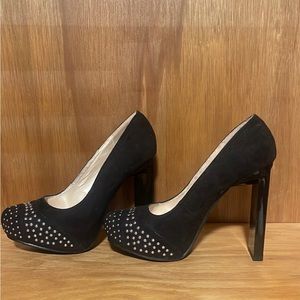 Black heels with silver details.